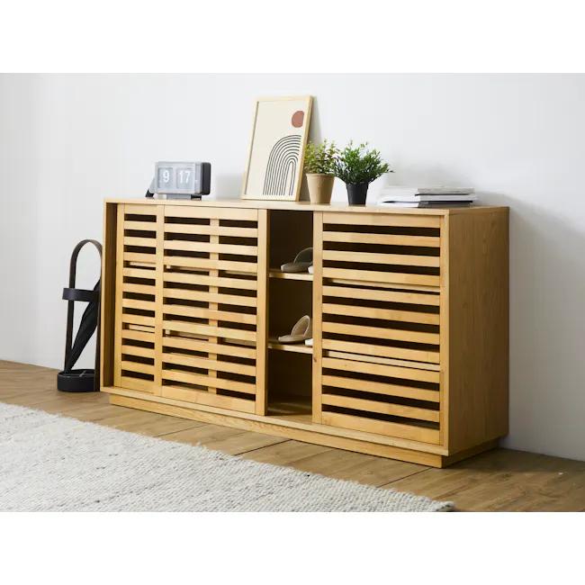 Keita Low Shoe Cabinet - Walnut - 2 - Wooden cabinet with slatted design, light wooden floor, white rug, black floor lamp