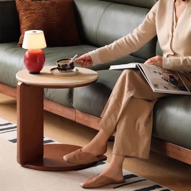 Blair Round Coffee Table - Travertine (Sintered Stone) - 6 - Sipping coffee, reading magazine, cozy sofa, beige cardigan