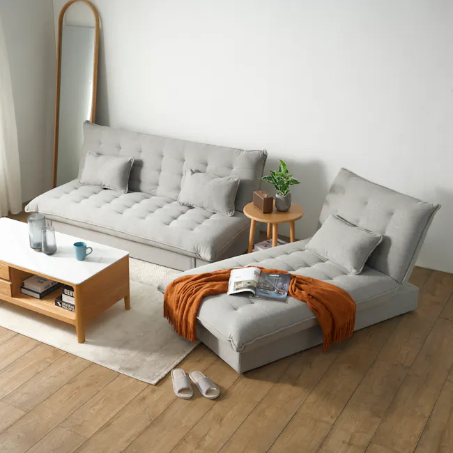 Tessa Storage Lounge Sofa Bed - Charcoal (Eco Clean Fabric) - 18 - Light gray tufted sofa, wooden coffee table, orange throw