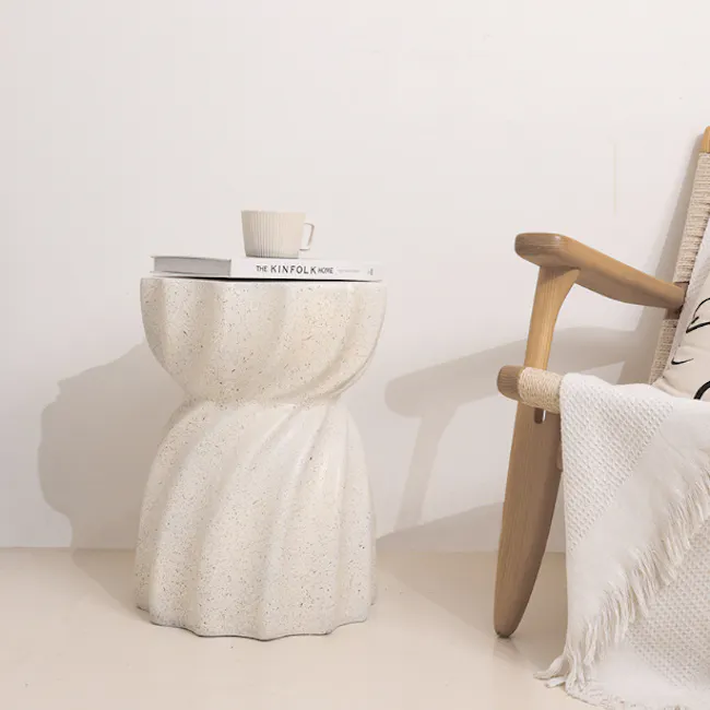 Evelyn Swirl Terrazzo Side Table - 5 - White textured stool, minimalist decor, modern interior, cozy corner, soft lighting