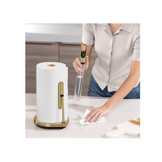 Simplehuman Tension Arm Paper Towel Holder with Pump - Brass - 4 - White paper towel roll, gold base, person holding
