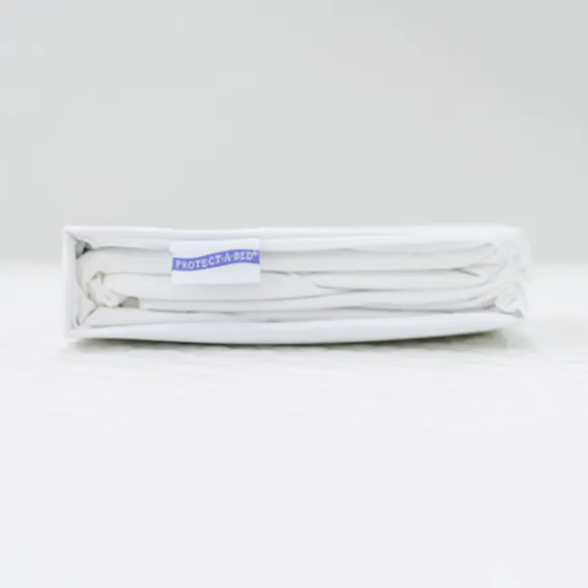 King Koil Basic Fitted Waterproof Mattress Pad (5 Sizes) - 4 - Folded white linens neatly stacked, White protective bedding