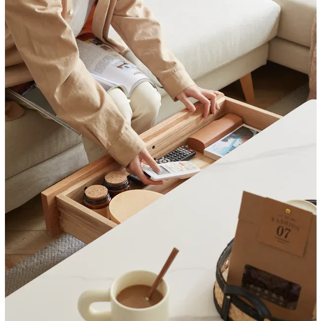 Devin Coffee Table 1.2m (Sintered Stone) - 13 - Soft beige jacket, wooden drawer, open drawer, beige sofa, wooden floor