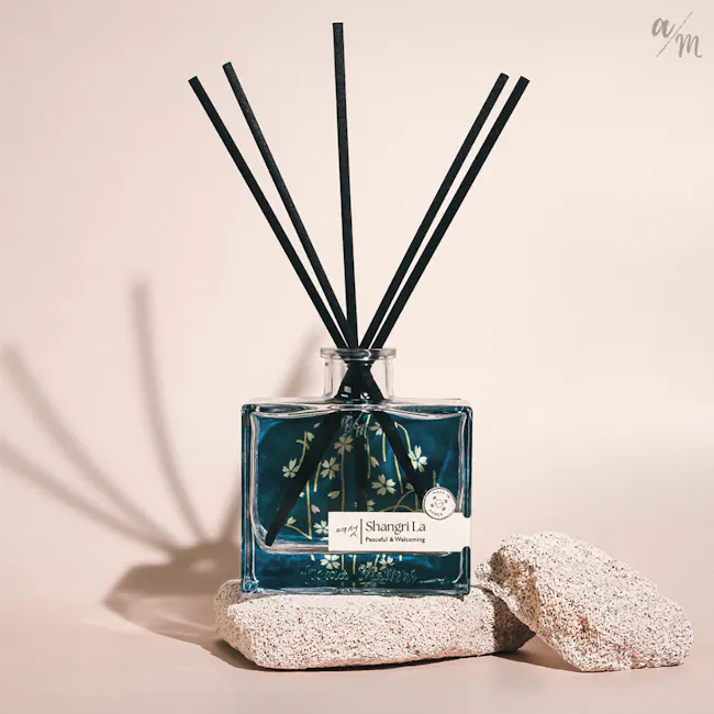 Aroma Matters Reed Diffuser - Shangri La (2 Sizes) - 2 - Shangri-La Fragrance bottle, black sticks, clear glass bottle, blue