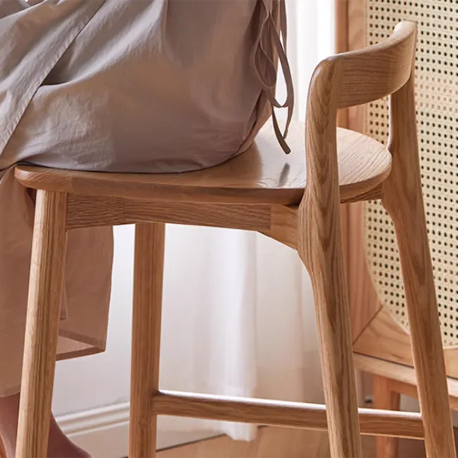 Rika Bar Chair - 4 - Wooden chair, beige fabric, natural wood finish, minimalist design, cozy seating, soft lighting, wooden