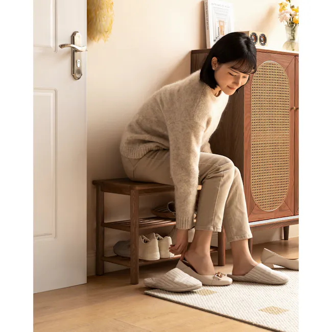 Azumi Shoe Rack Bench 0.6m - Walnut - 2 - White door with metallic handle, beige sweater, light brown pants, wooden stool