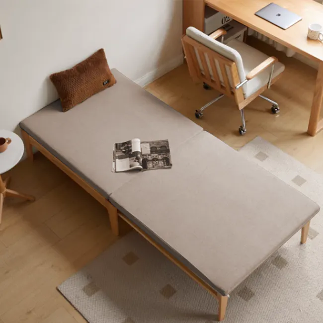 Mariel Lounge Sofa Bed - Chestnut - 3 - Wooden bed with beige cover, brown pillow, small round table with brown cup, wooden