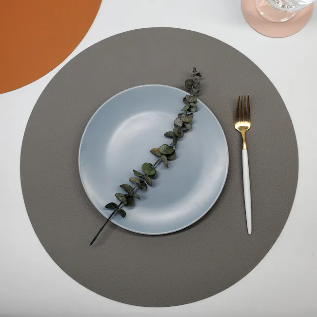 RAPEE PERI Duo Side Placemat - Navy Grey - 4 - Light blue plate, textured gray placemat, elegant fork, gold-colored fork
