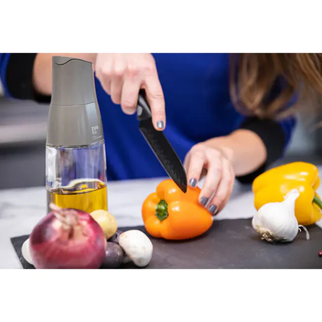 Zuutii Drip-Free Oil Carafe - Deep Blue - 8 - woman slicing bell pepper, kitchen countertop, fresh vegetables, chopping