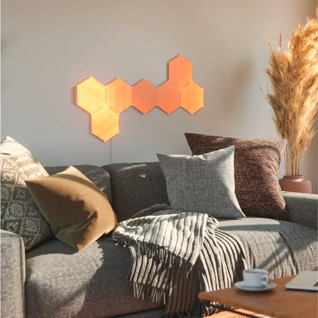 Nanoleaf Elements Wood Look Expansion Pack (3 Panels) - 5 - Modern living room, cozy sofa, geometric wall art, warm