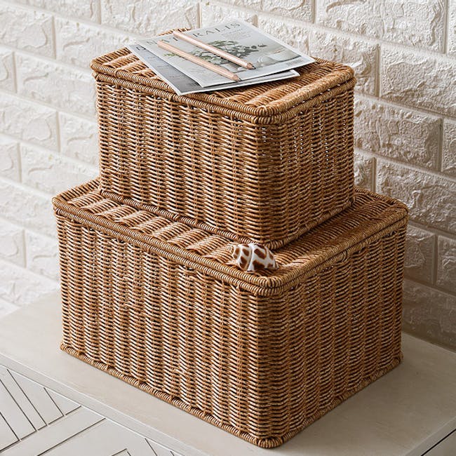 Gabriel Rattan Storage Basket With Lid (3 Sizes) - 3 - Woven wicker basket, beige and brown tones, stacked on table, outdoor