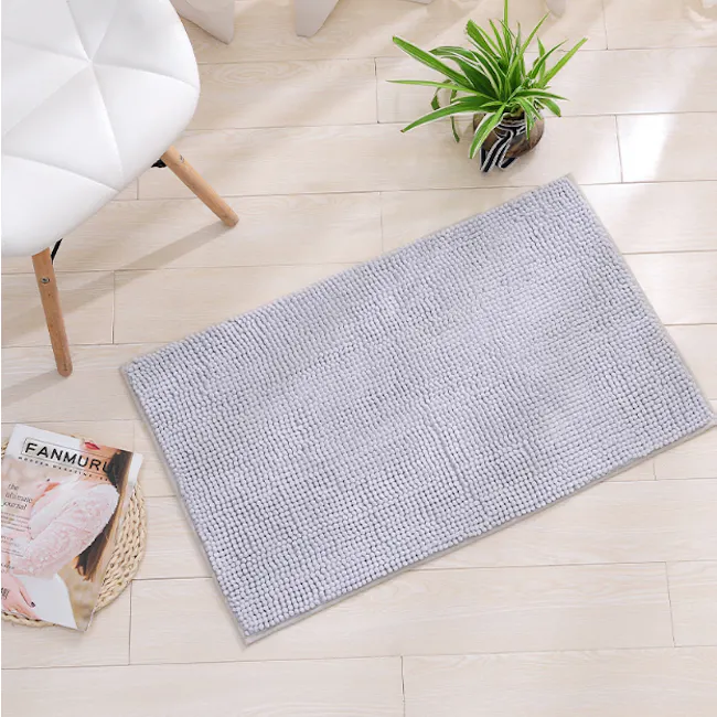 Cora Chenille Big Bath Mat - Light Grey - 2 - Light-colored, textured rug on wooden floor, Minimalist living room setting