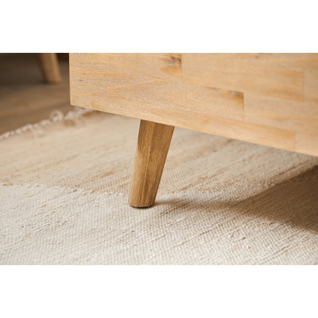 Todd Queen Bed - 11 - Light wooden table with visible grain and texture, close-up view, natural wood finish, rustic design