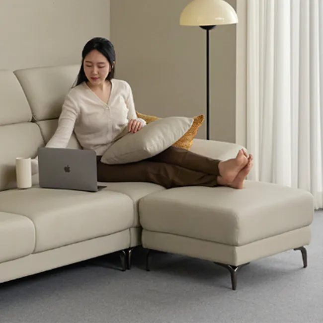 Room setting featuring Montreal Ottoman - Ivory (Faux Leather)