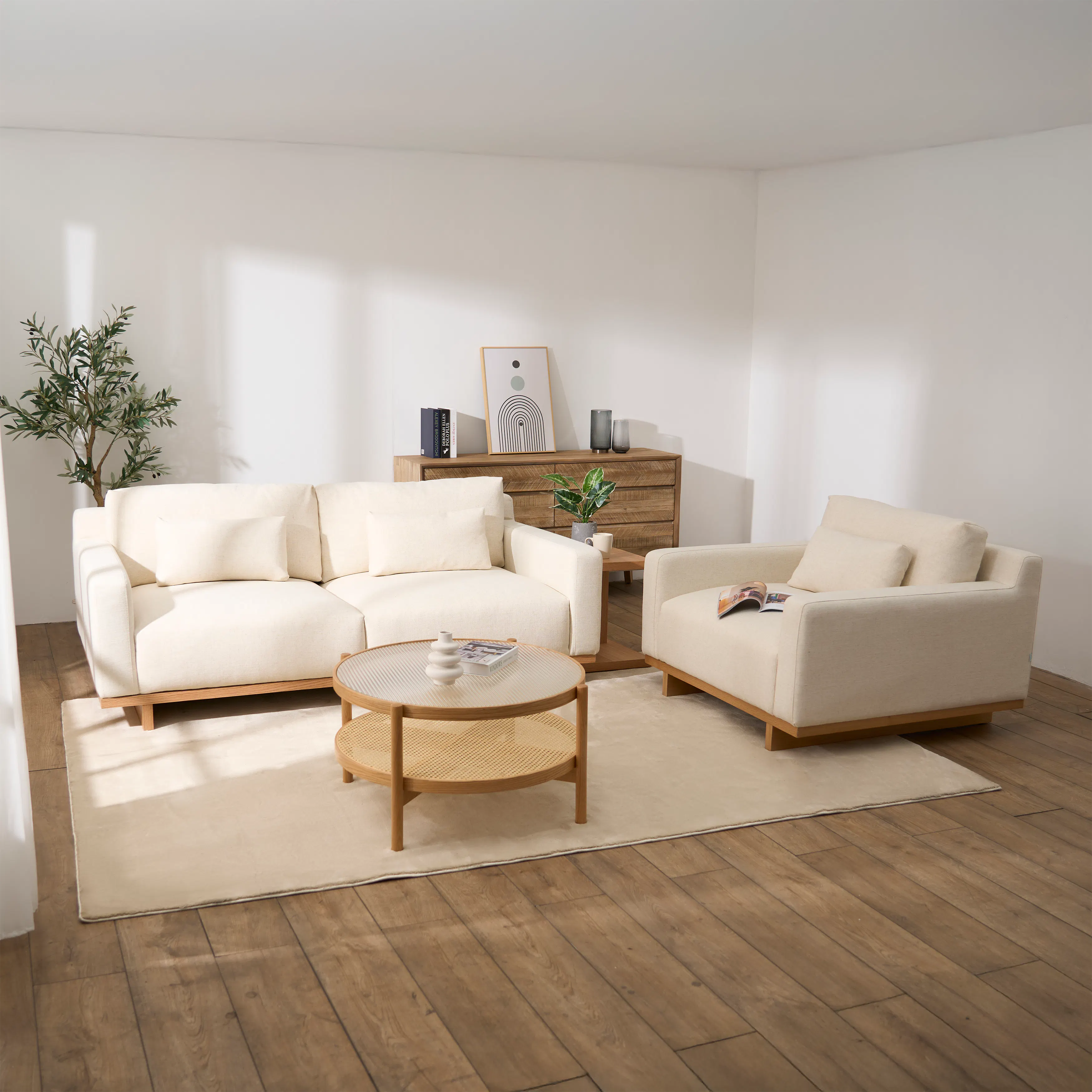 Miu 3 Seater Lounge Sofa - 9 - Minimalist living room with modern furniture, cream-colored sofa and armchair, round coffee