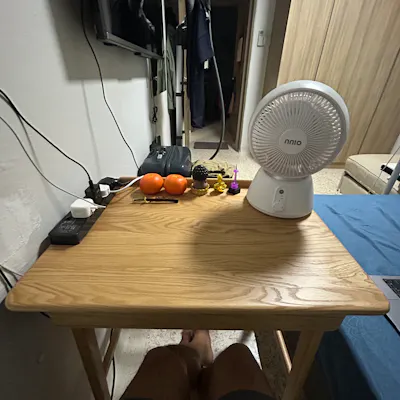 Customer home photo 2: If your room is not that big. This 70cm width table would great for a snug fit. Simple but nicely polished wood, feels comfortable to the touch.