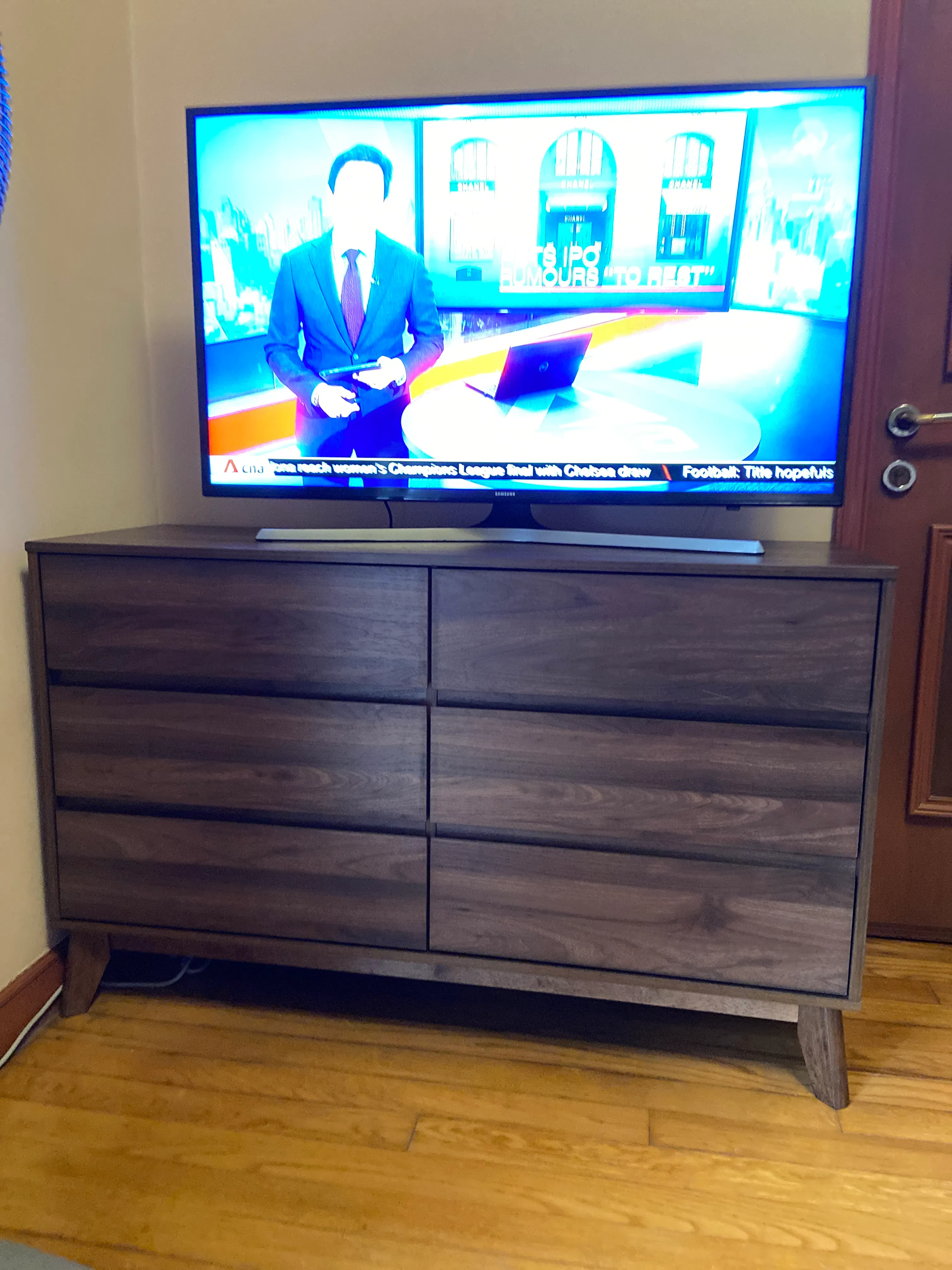 Customer home photo 5: Fits in snugly at the corner of room. Height just right -at eye level - for a TV. Drawers can be drawn so smoothly. Kudos to the installation team for job well done.