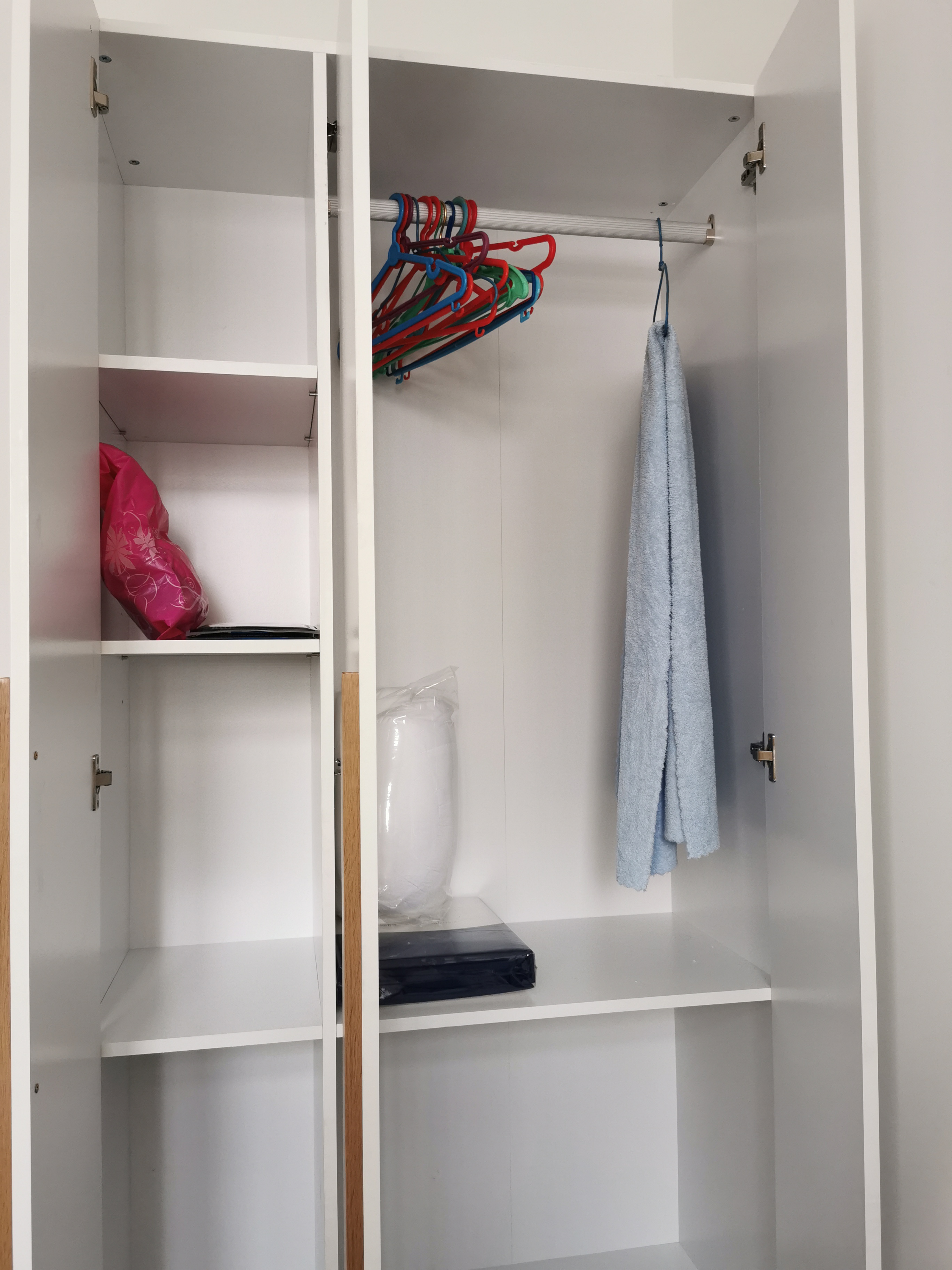 Customer home photo 17: 3 door cabinet. Nice color and consider as a medium cabinet. A note to take note do not put heavy clothes inside this cabinet. It is for light clothing and some other personal belongings.
