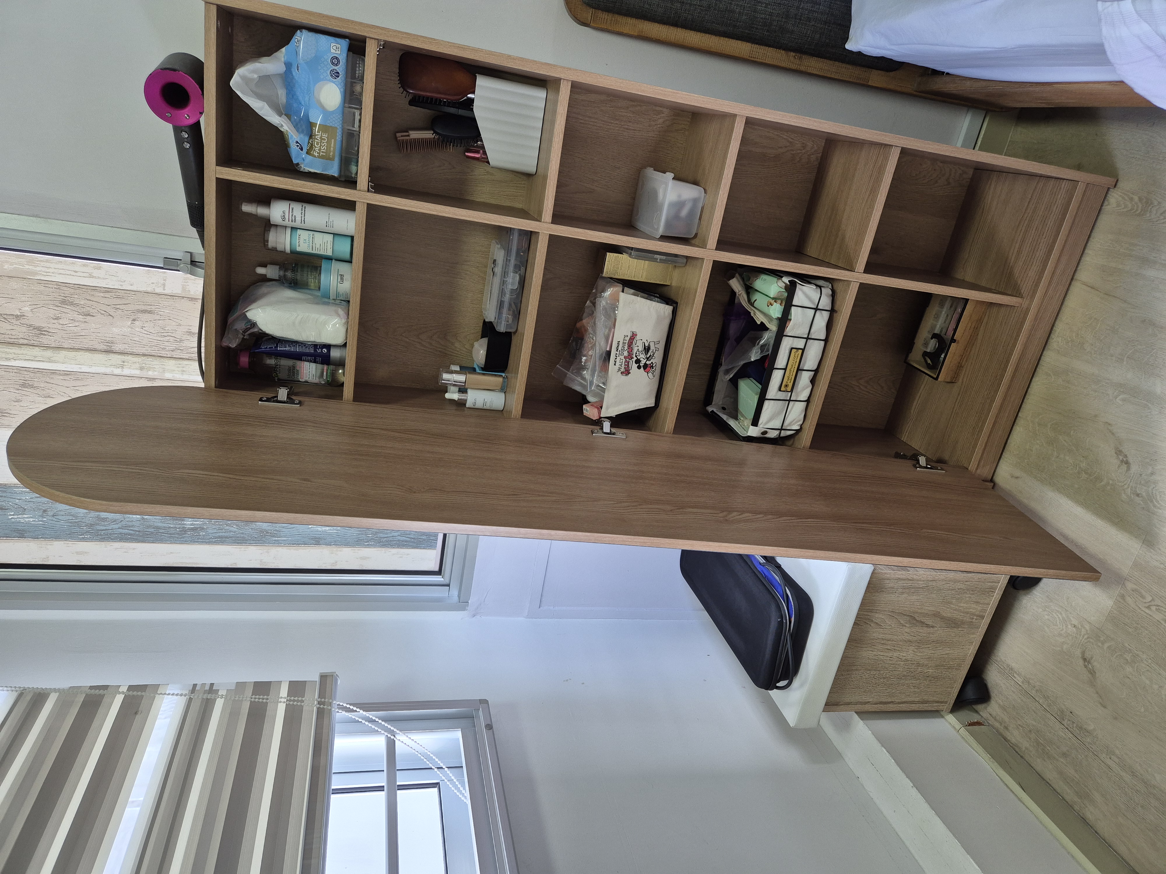 Customer home photo 17: I like the functional design with ample storage. Quality wise is ok (manage your expectation as its not solid wood). The top edges can be rather sharp so had to sandpaper them.