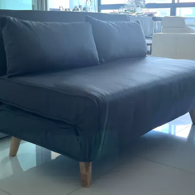 Customer home photo 3: The Noel 2-Seater Sofa Bed fits beautifully into a smaller space with its minimalistic, compact design. It doesn’t overpower the room and complements a clean, modern setup. Setup was easy — it came mostly assembled and just needed a few quick adjustments.
For the price, it definitely feels like good value. The fabric has a nice look and texture, and it’s comfortable enough for short-term use. We’ve had guests sleep on it for a couple of nights and they were quite okay with it.
That said, it’s not really a full-time sofa alternative. The seating is a bit low, and there’s a light creaking noise when sitting down or getting up. Also, the zippers don’t feel super sturdy, so I’m a little cautious about how it’ll hold up over time. But for occasional use, it serves its purpose well.