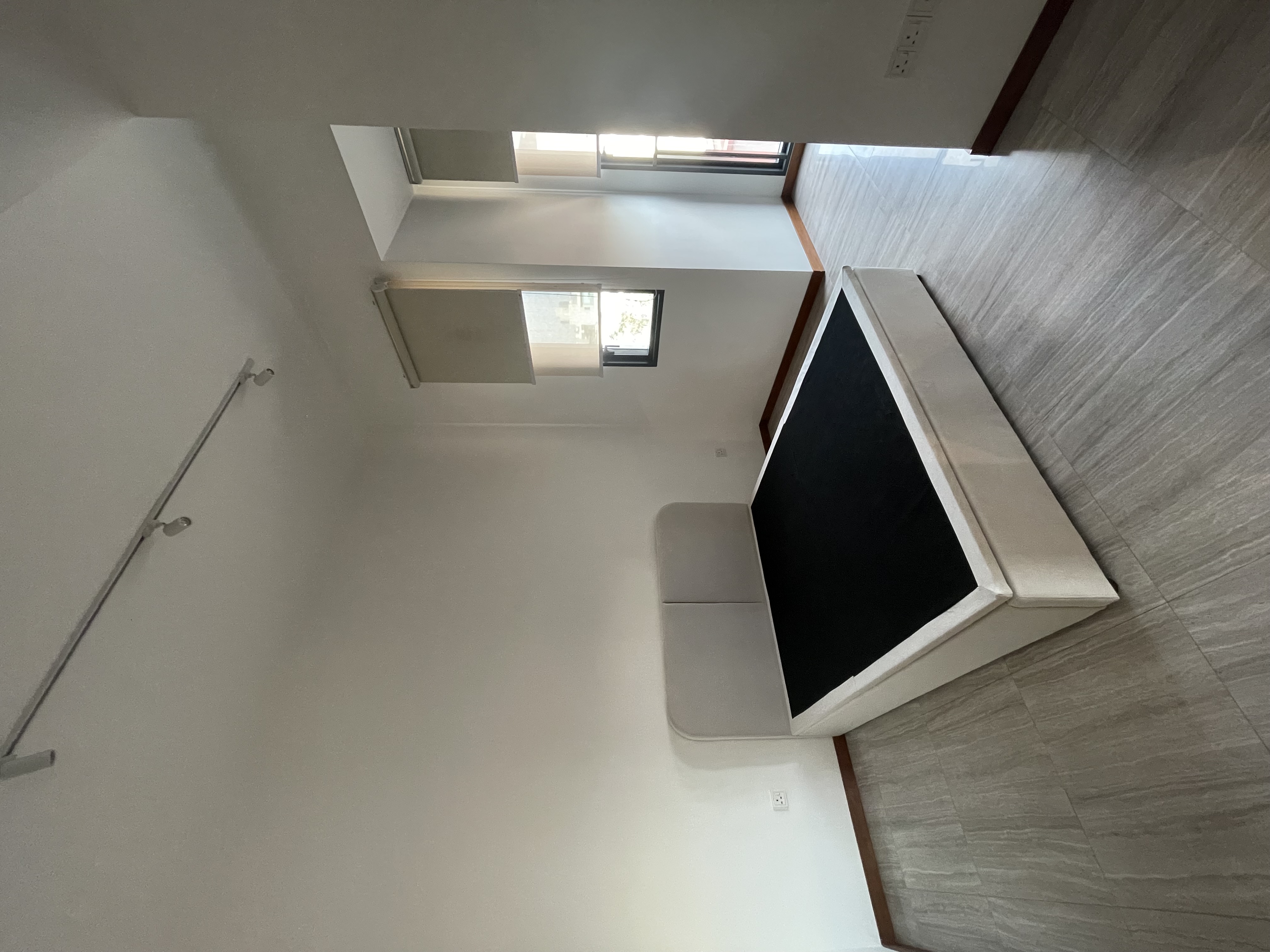 Customer home photo 22: Love the color and simple design. The storage height is tall enough to fit my large suitcases. Very easy to lift and lower with the hydraulic mechanism.