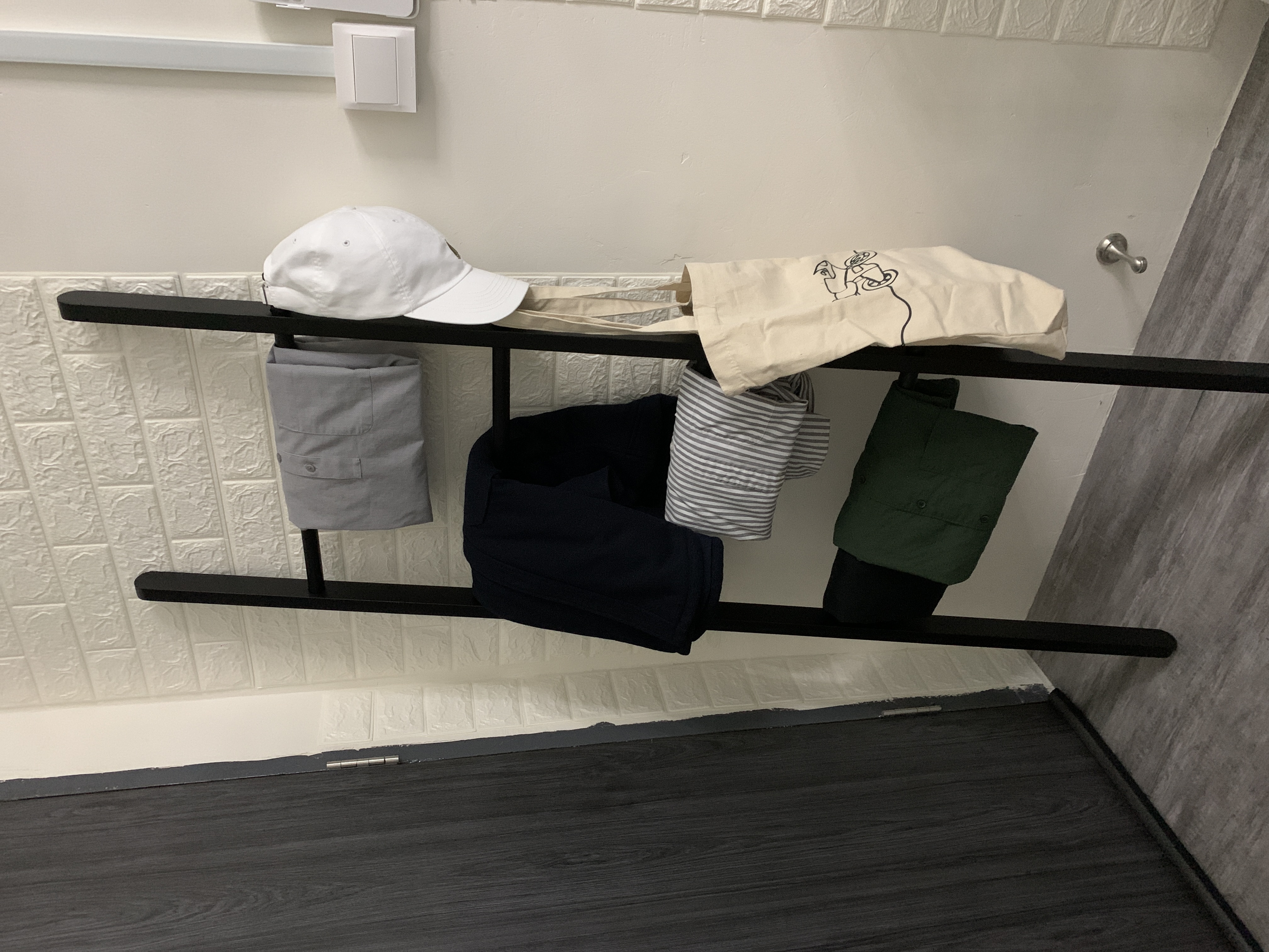 Customer home photo 5: Easy to assemble , sturdy enough to hold your towels , jackets etc .. a must have essential :)