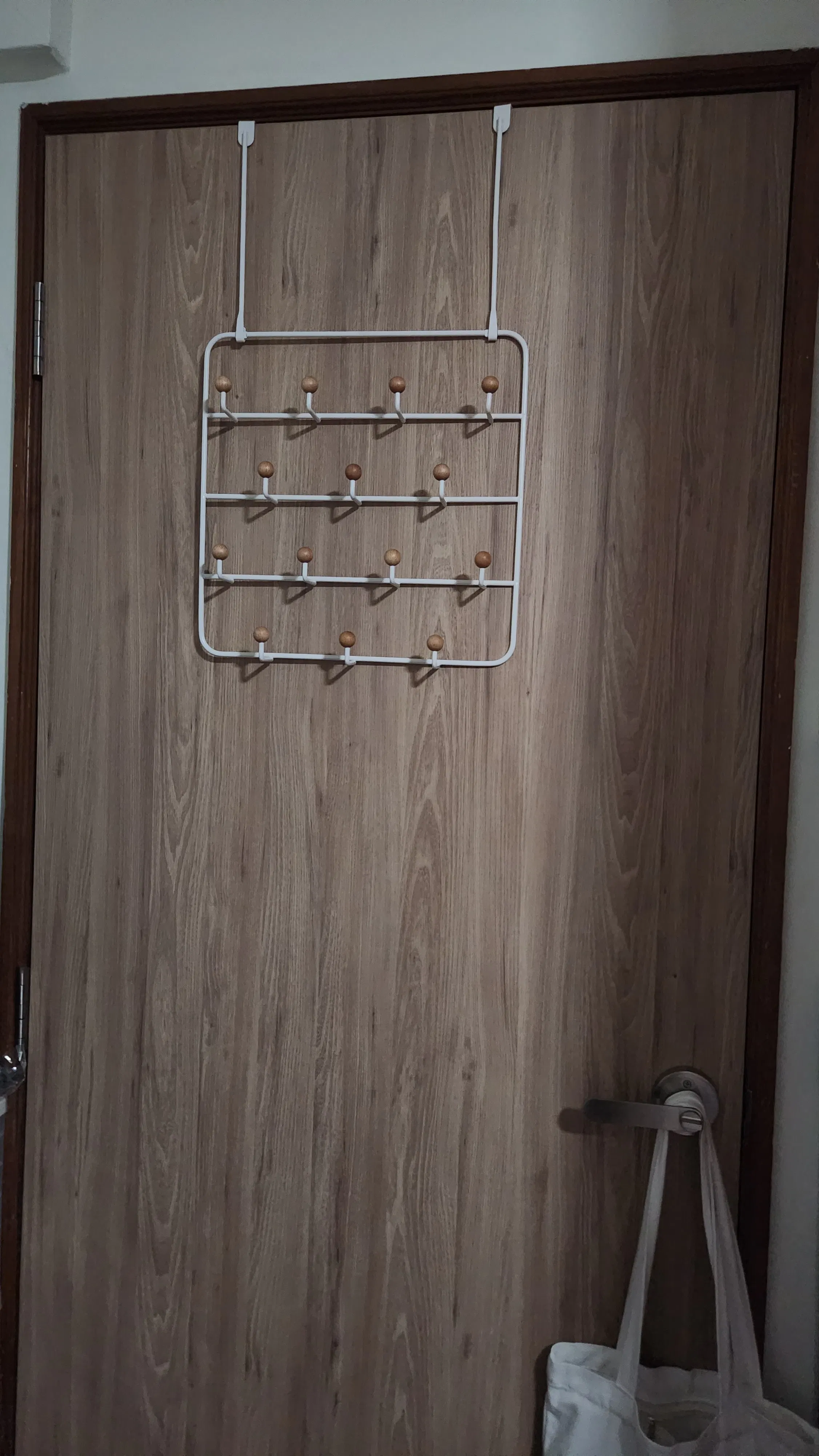 Customer home photo 2: fits the aesthetic of my room, able to hold many items and it makes my door look less plain.