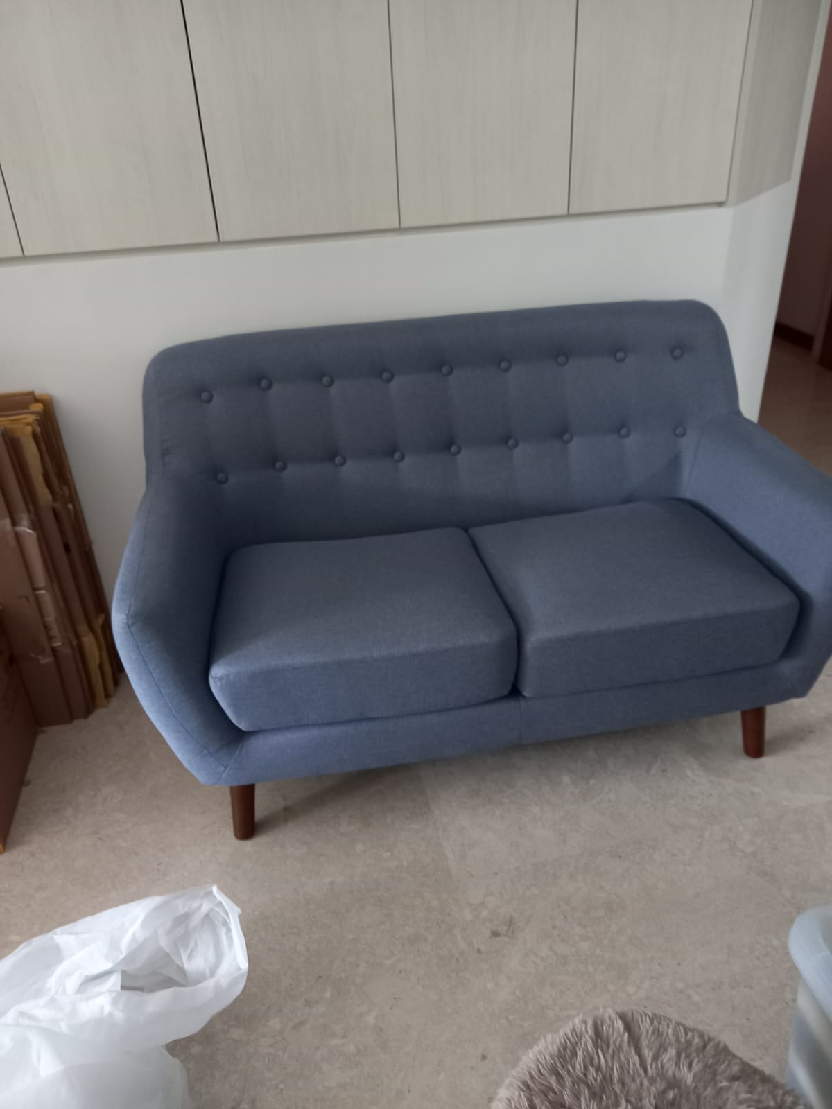 Customer home photo 9: Functional sofa that fits into 2 bedroom apartment. The seat is not so deep nor soft for a super comfortable lounge but it is good value.