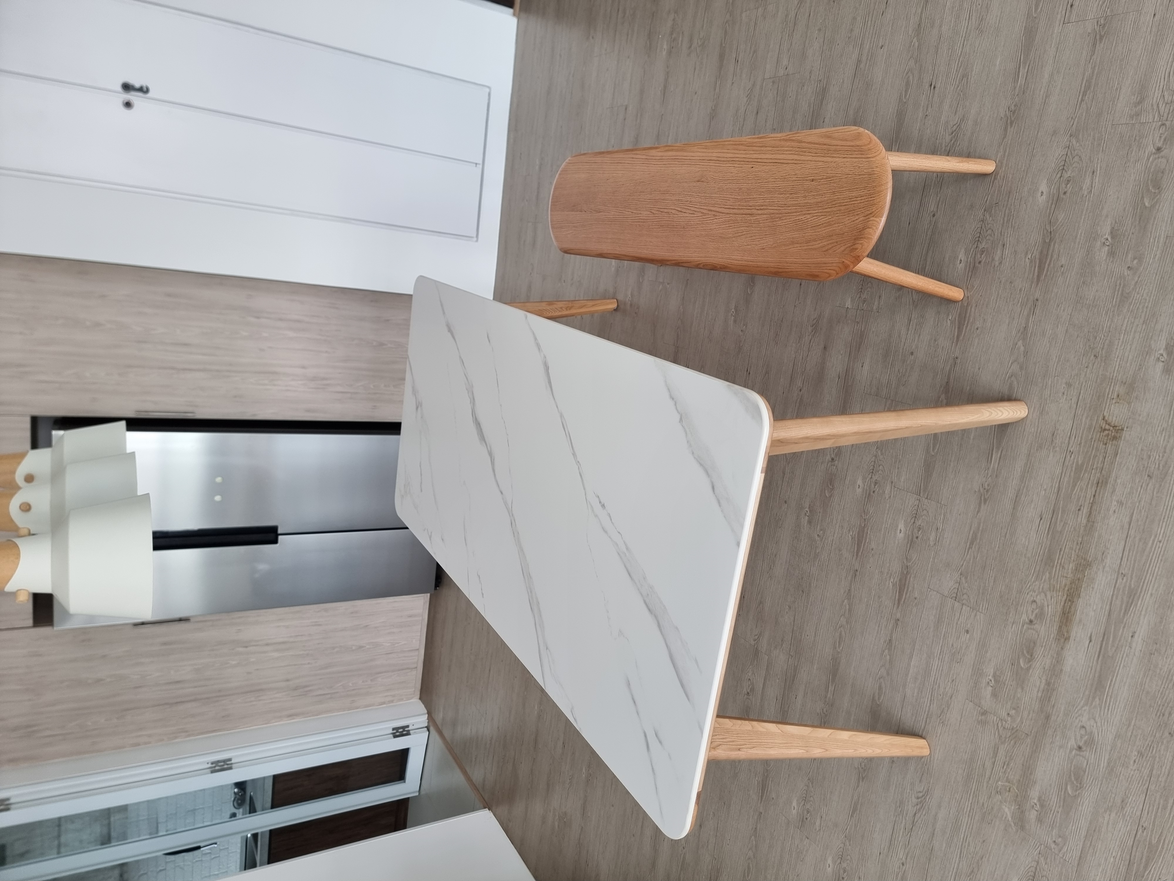 Customer home photo 3: Matches perfectly with the Nellie dining table and the scandi theme of my apartment. Delivery was prompt, finishing is almost perfect. Comes with floor protector stickers on the legs. Feels sturdy, doesn't wobble.