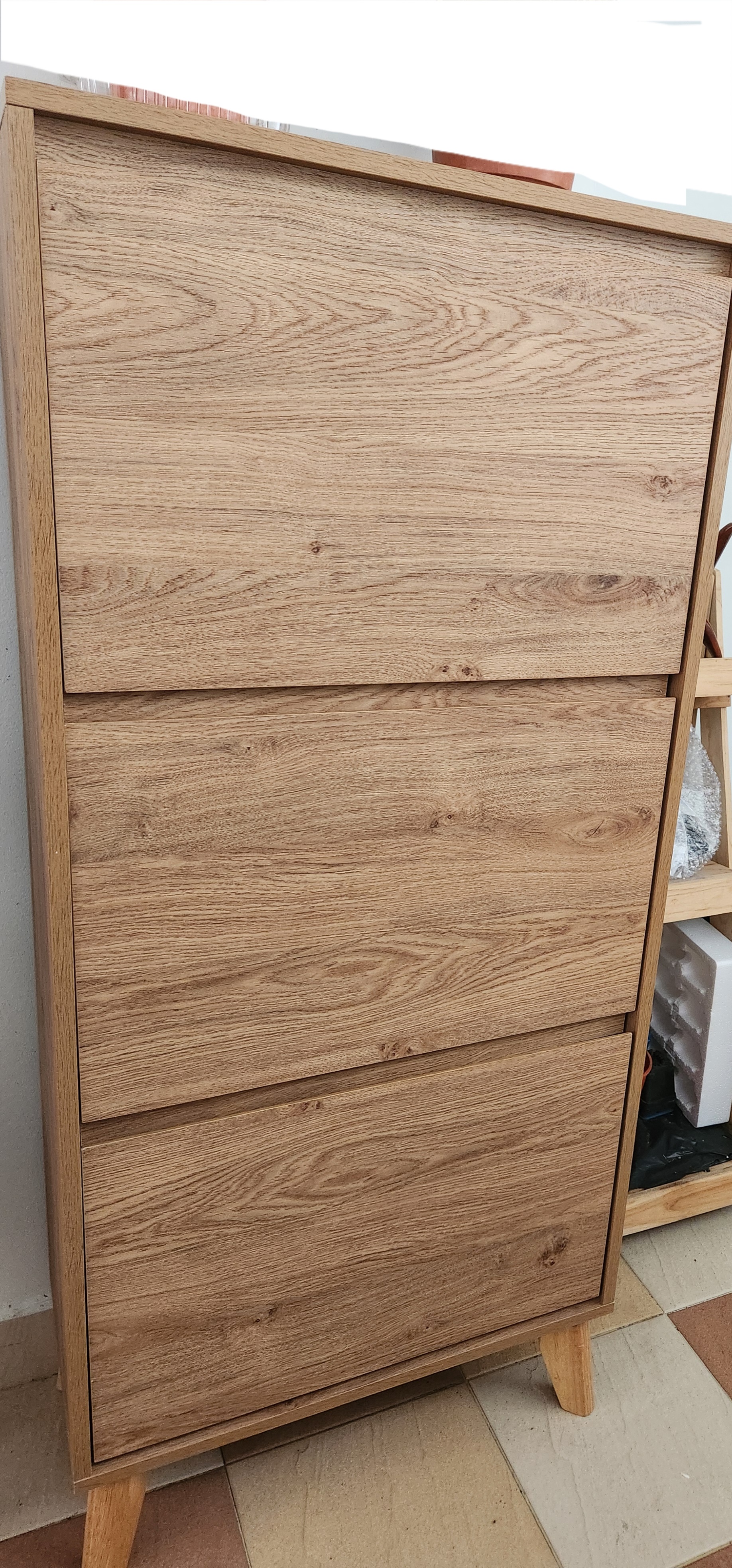Customer home photo 3: Like the colour and the stern material. Sleek design and can store quite a number of shoes for my family of 4.