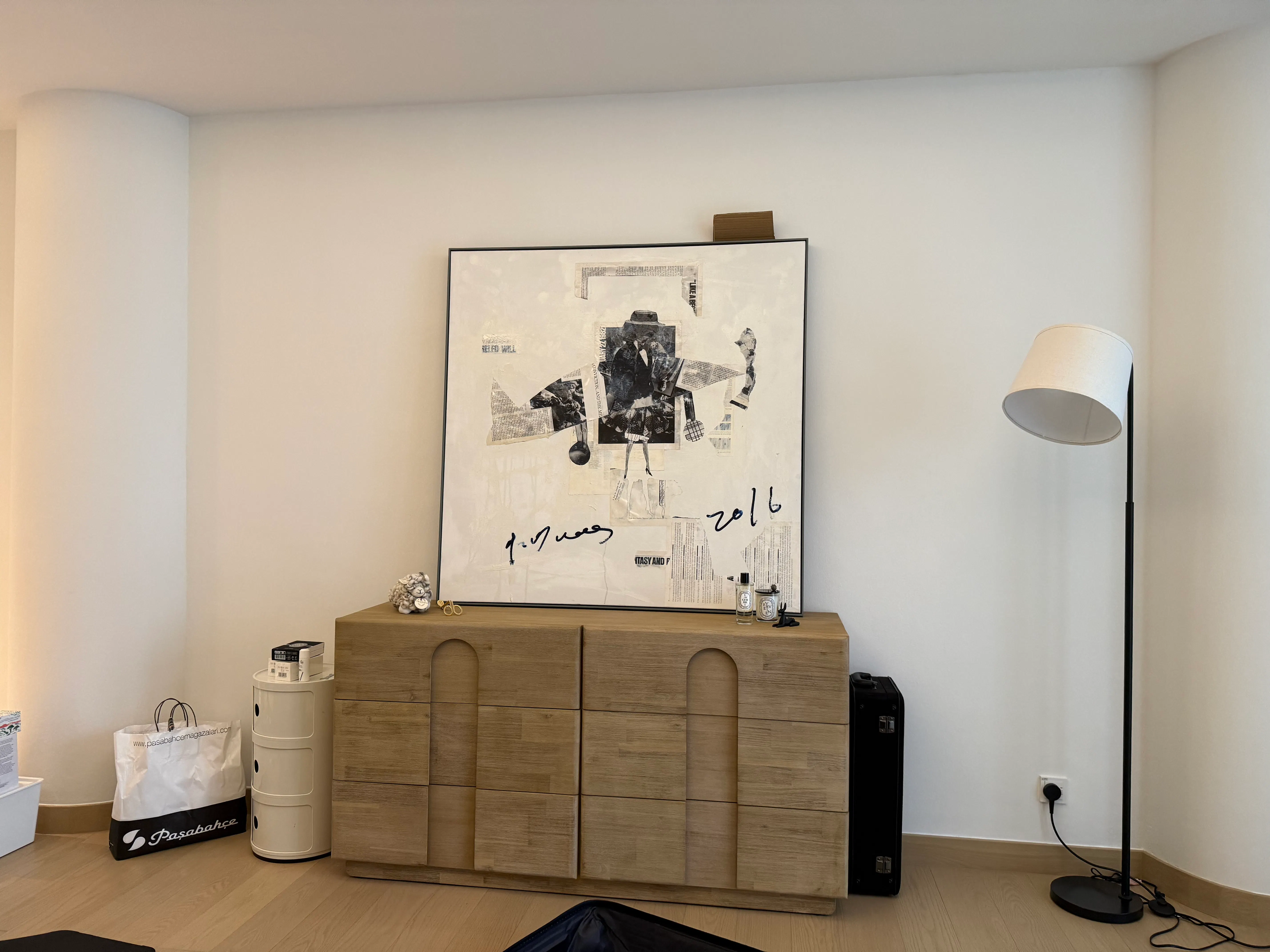 Customer home photo 1: Purchased together with bed side cabinets. A lot of space for my clothing. And love the design and colour tone. Photo was taken during moving, still not tidy but will be good for sure.