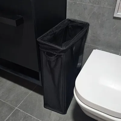 Customer home photo 4: Looked everywhere to find a laundry basket with this dimensions & was SO HAPPY to find this one - it fits perfectly in our bathroom. Quality of this laundry hamper is also great and it has all the right features: handles at the side to carry it to the washer, a little handle in front to pull it out and push it back in, and drawstring at the top to close it up when we need to (e.g. when guests come over).