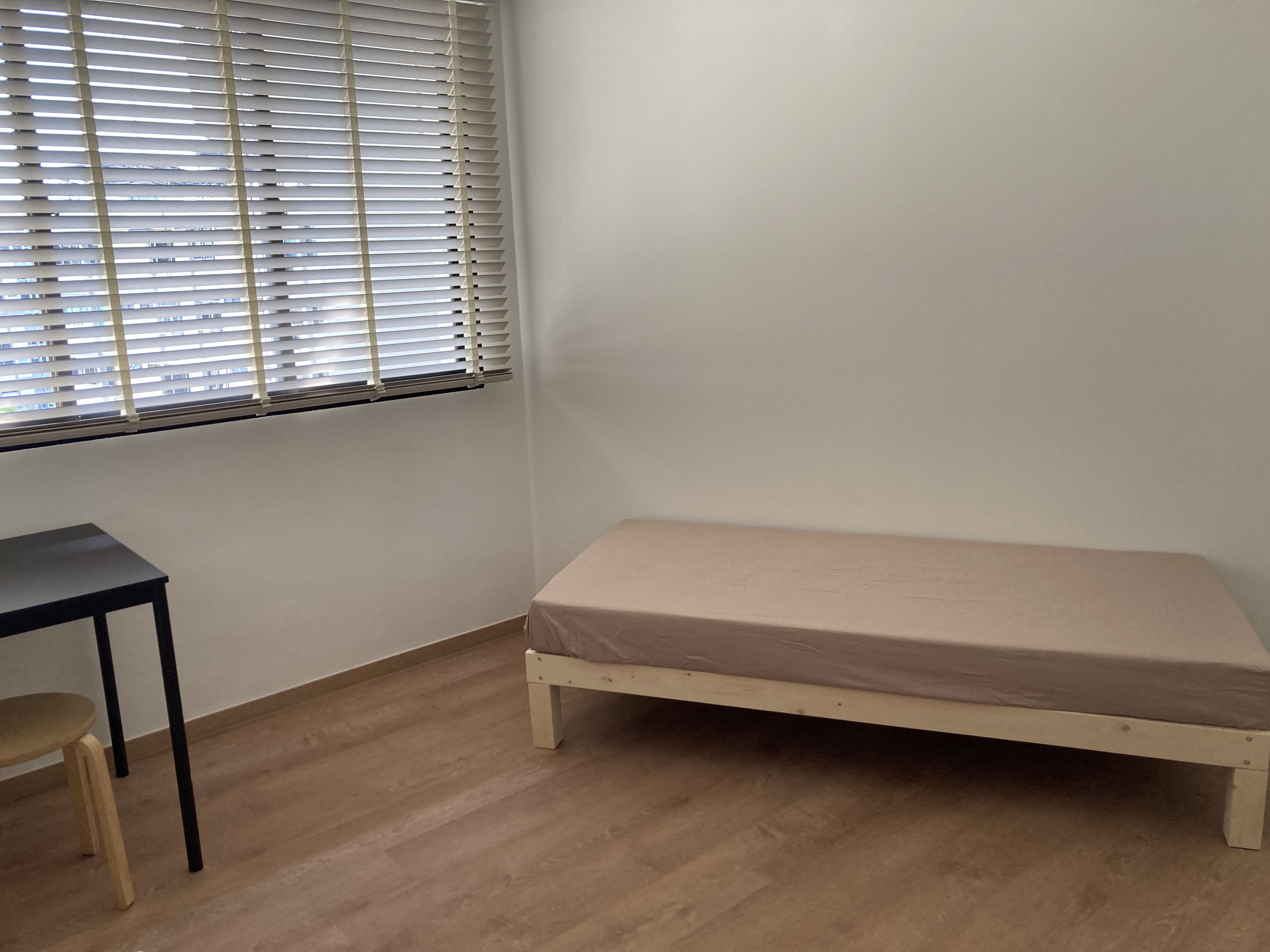 Customer home photo 3: Sturdy, simple & well designed, love the space underneath for extra storage, very functional.  Mattress sits on top of slats, easy to change bedsheets.  Great value for money.  Don't have to wait half a day or full day like others, delivered within 1hr schedule.