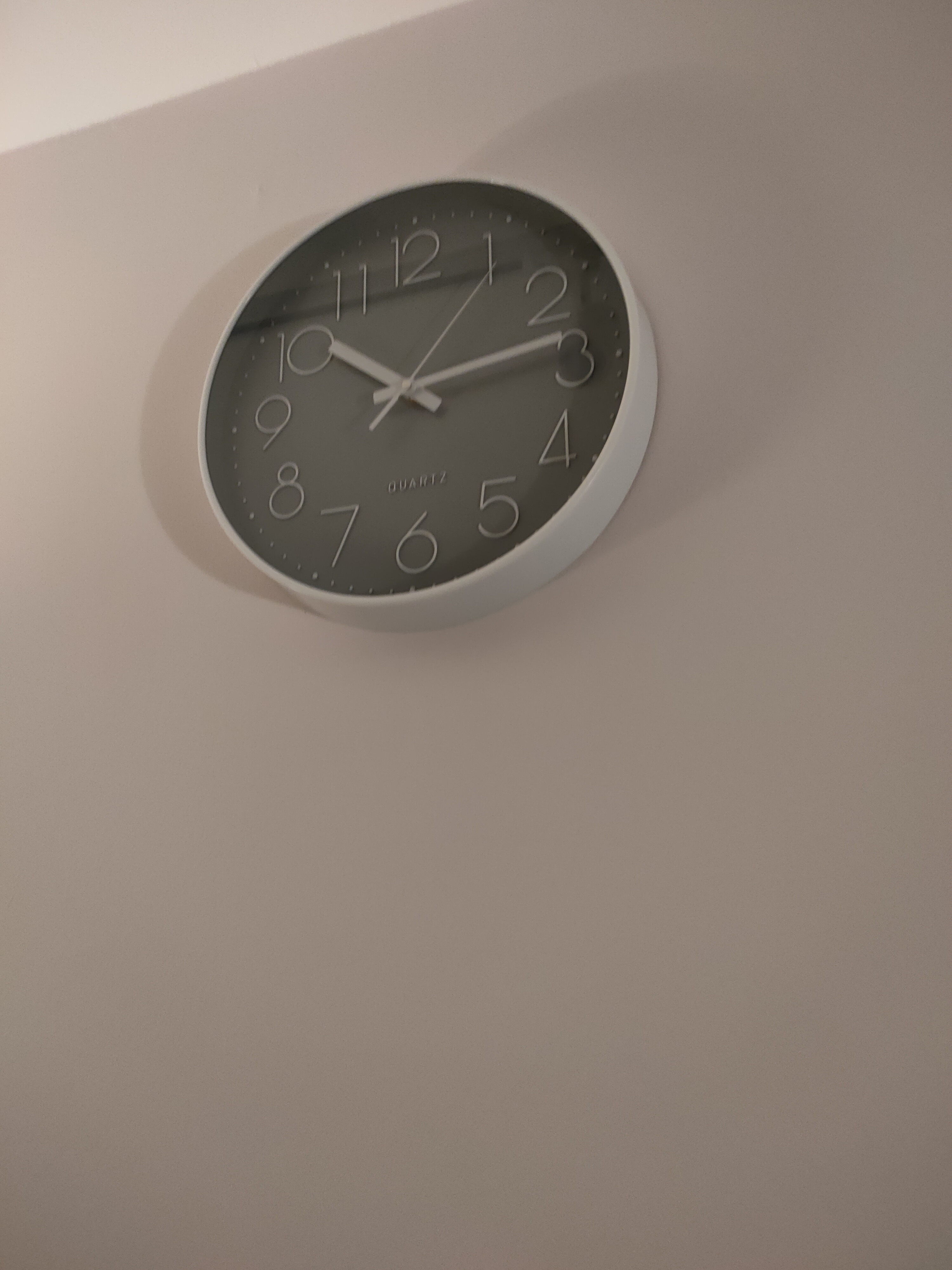 Customer home photo 3: Clock is a nice grey and works well thus far.  Soothing colour and premium looking.
