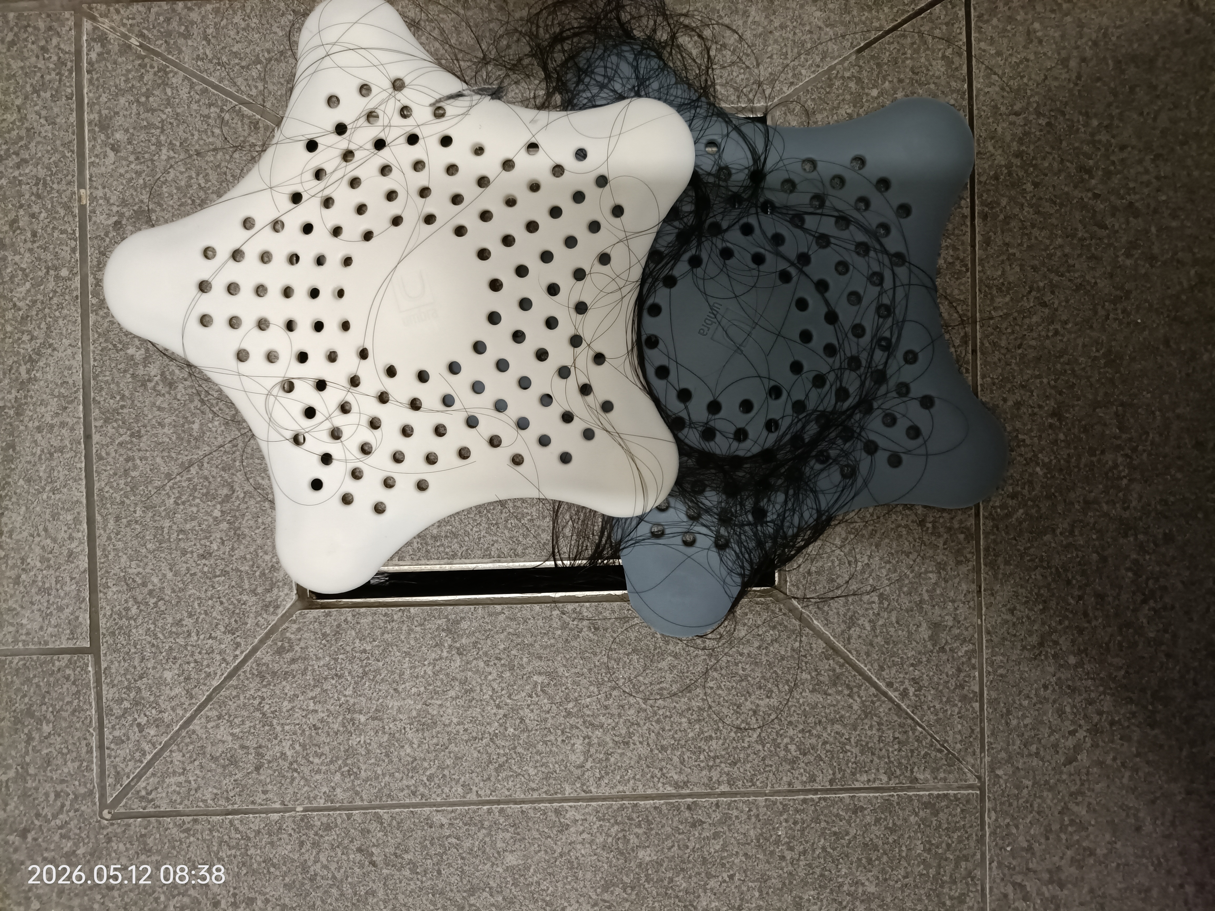 Customer home photo 1: Left the last one of the slate blue hair catcher. They serve their purpose to prevent hair from flowing into the drainer which will cause the water flow slower. It's useful and the quality is good too.