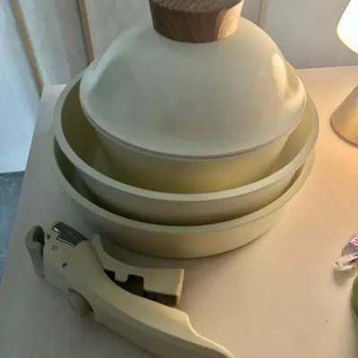 Customer home photo 30: Aesthetically pleasing and genuinely non-stick. Comes with a lid for the small pot only, the other two pans are lidless.