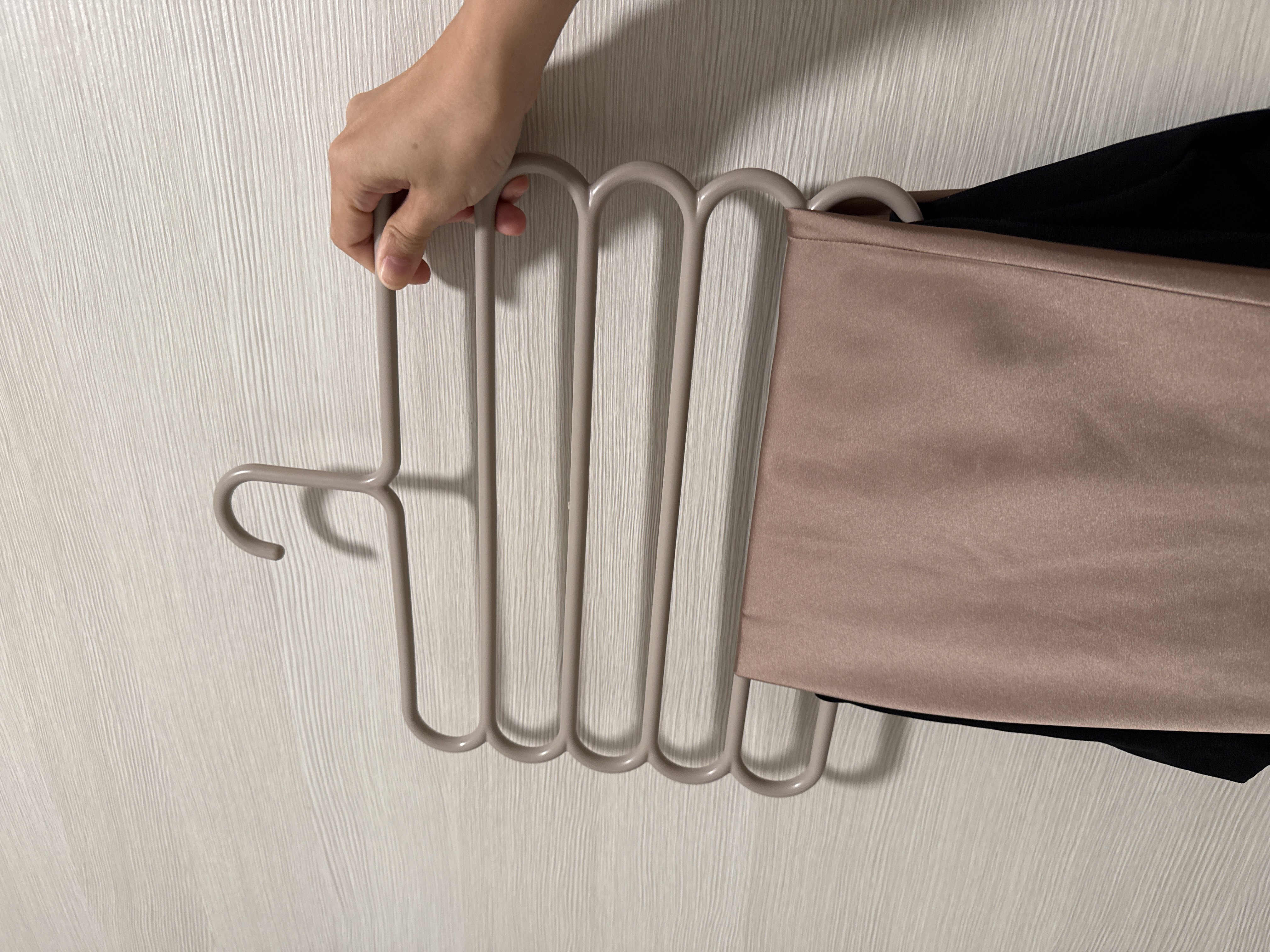 Customer home photo 4: Fits up to 5 pcs of clothing! You might have to fold the pants a bit if its too wide legged, but width is just right to fit most cabinets as it is of standard width. Looks sturdy!