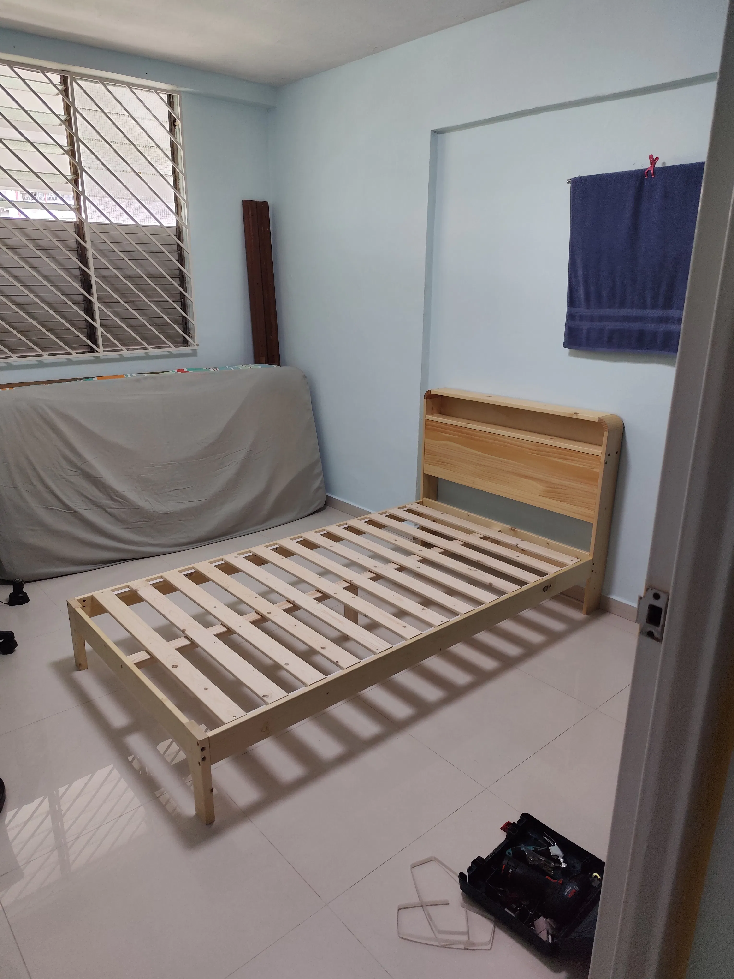 Customer home photo 10: A sturdy and good bed. Bought after seeing positive reviews. There's a cuppy area to put your phones, specs and remote control.