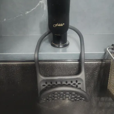 Customer home photo 4: Simple looking black sponge holder that goes well with a black sink