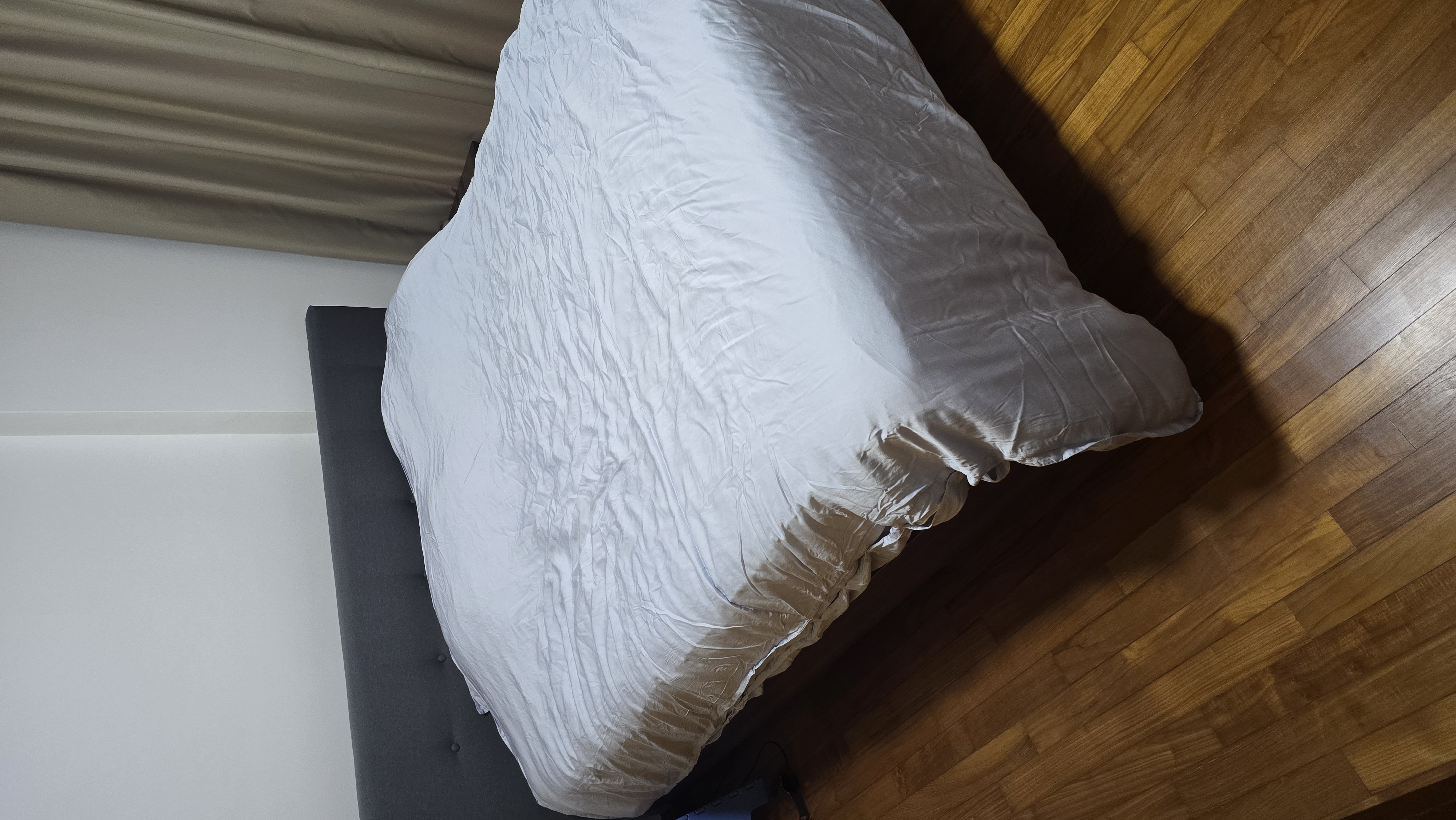 Customer home photo 1: Very nice and sturdy bedframe. This one doesn't make any noise when laying on it.