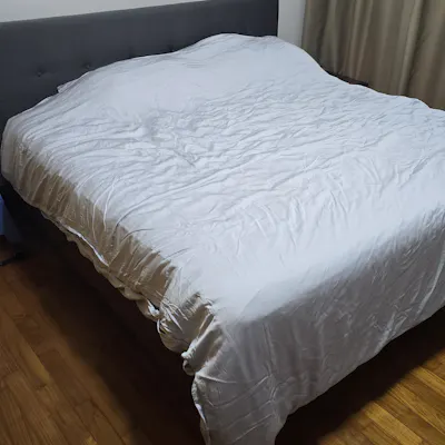 Customer home photo 1: Very nice and sturdy bedframe. This one doesn't make any noise when laying on it.
