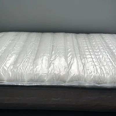Customer home photo 21: Delivery was prompt and efficient. The vacuum packed mattress was unpacked by delivery personnel and reinflated itself to full size in a few hours. Mattress is comfortable!
