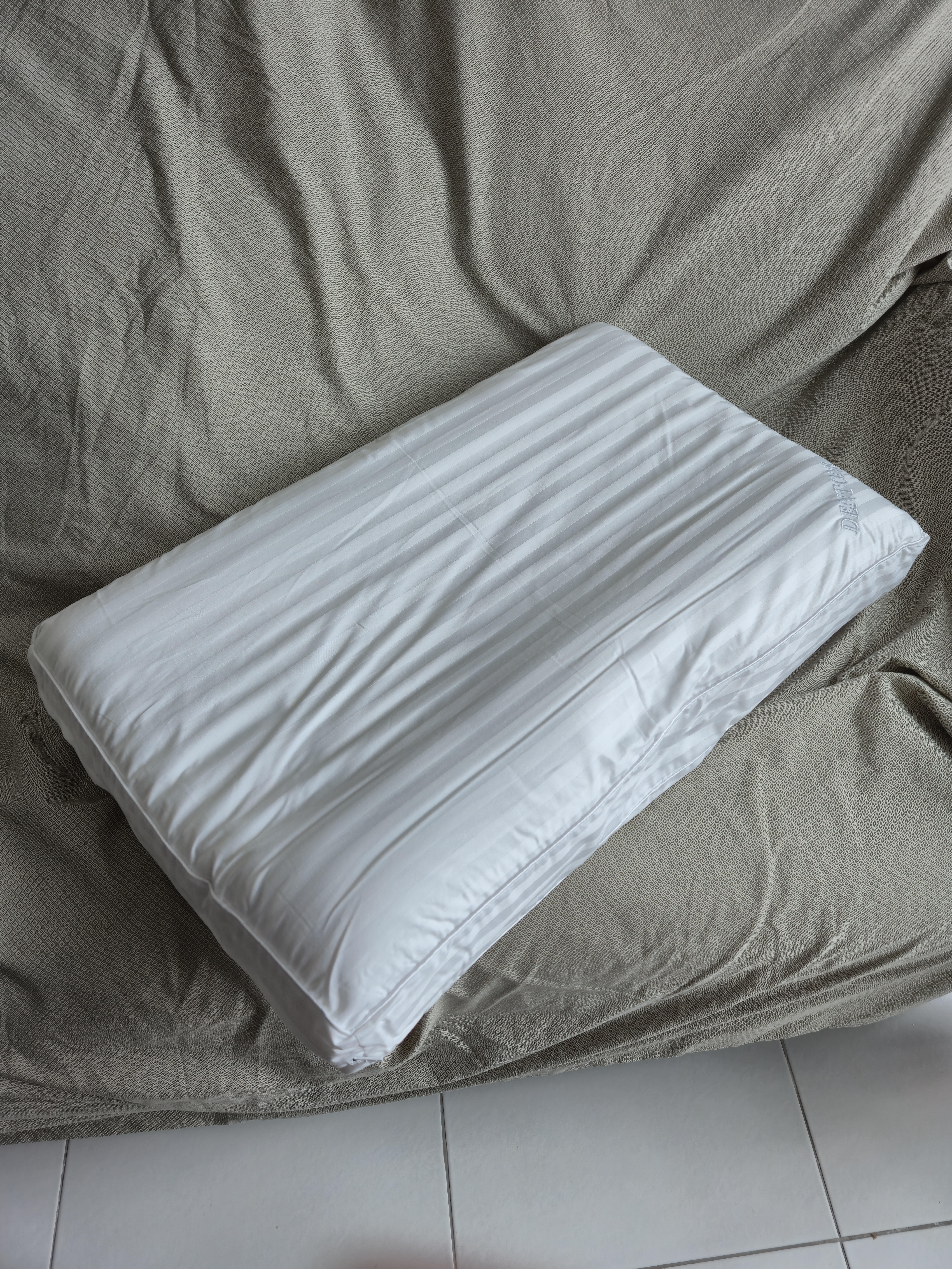 Customer home photo 1: I like the pillow's structured, contour support, it keeps my head, neck and spine aligned. The perfect pillow for me.