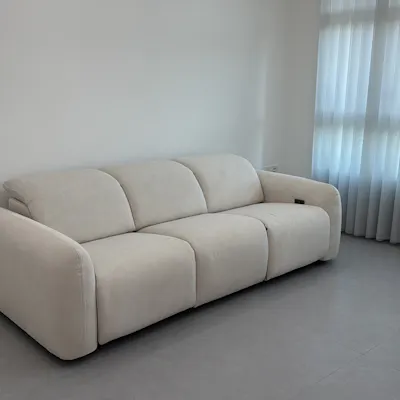 Customer home photo 4: Love it! So comfy, material is good, and pretty sturdy. The only downside is the plug for recliner is on one side which is far from our switch and sticks out abit but overall still looks good.