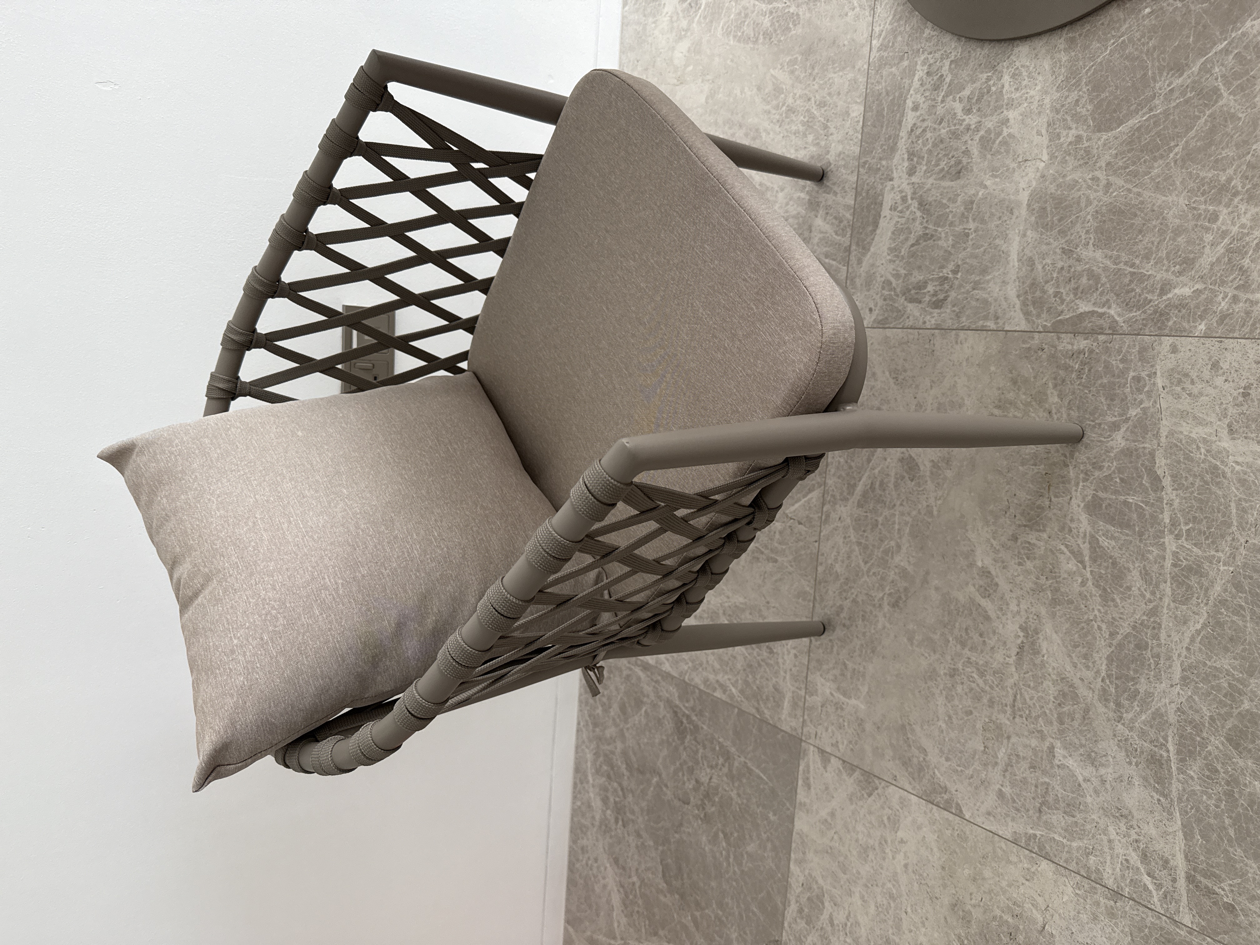 Customer home photo 1: Beautiful chair, very light and modern design. Comfortable cushion. Will definitely fit our little balcony.
