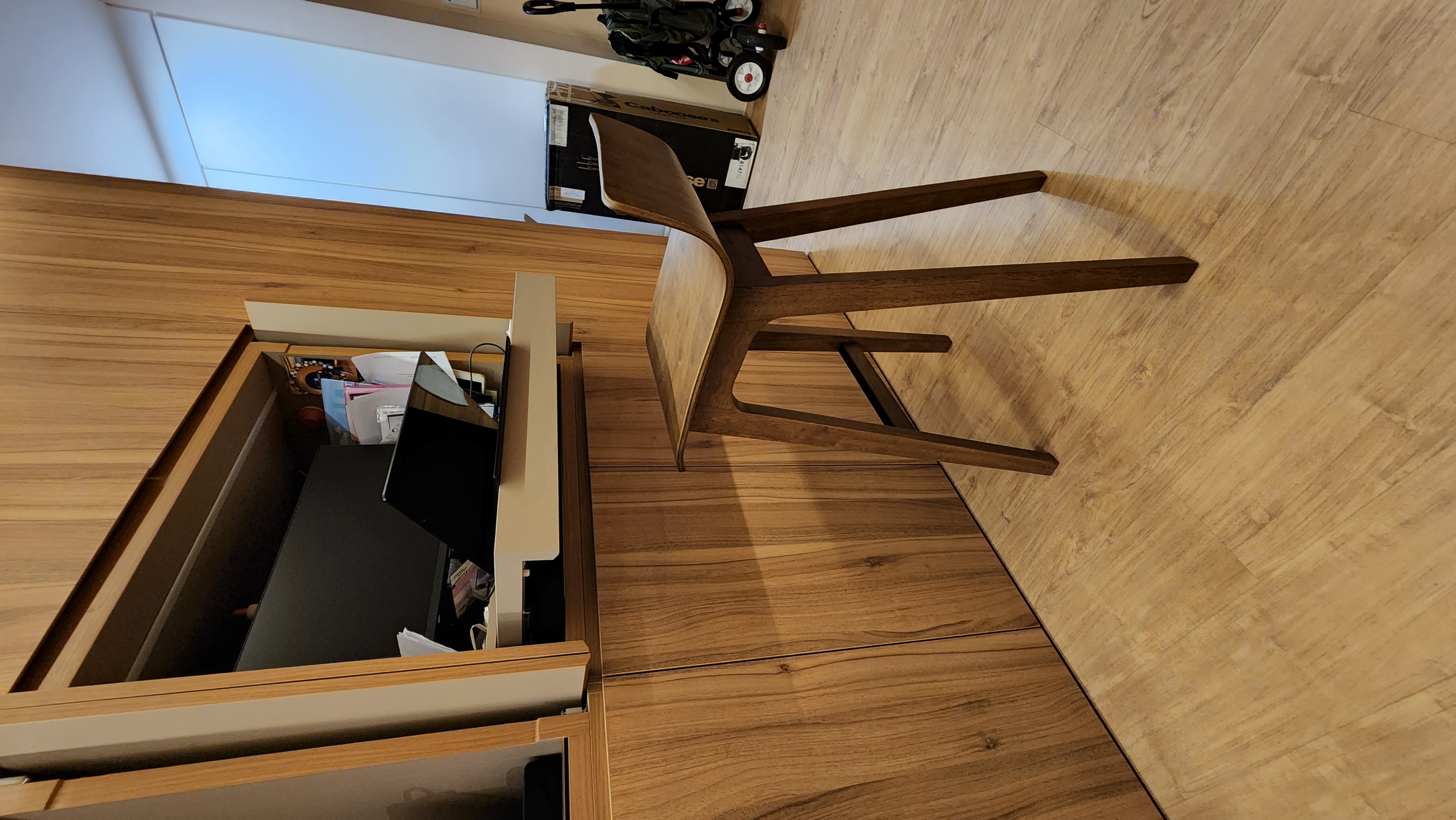 Customer home photo 2: The chair is solid and stable. Love the walnut tone too.