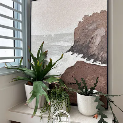 Customer home photo 9: Beautiful piece! The texture is amazing, and the colours are perfect for our space. Wish there was an option for a different coloured frame, but still an awesome buy 👍🏽