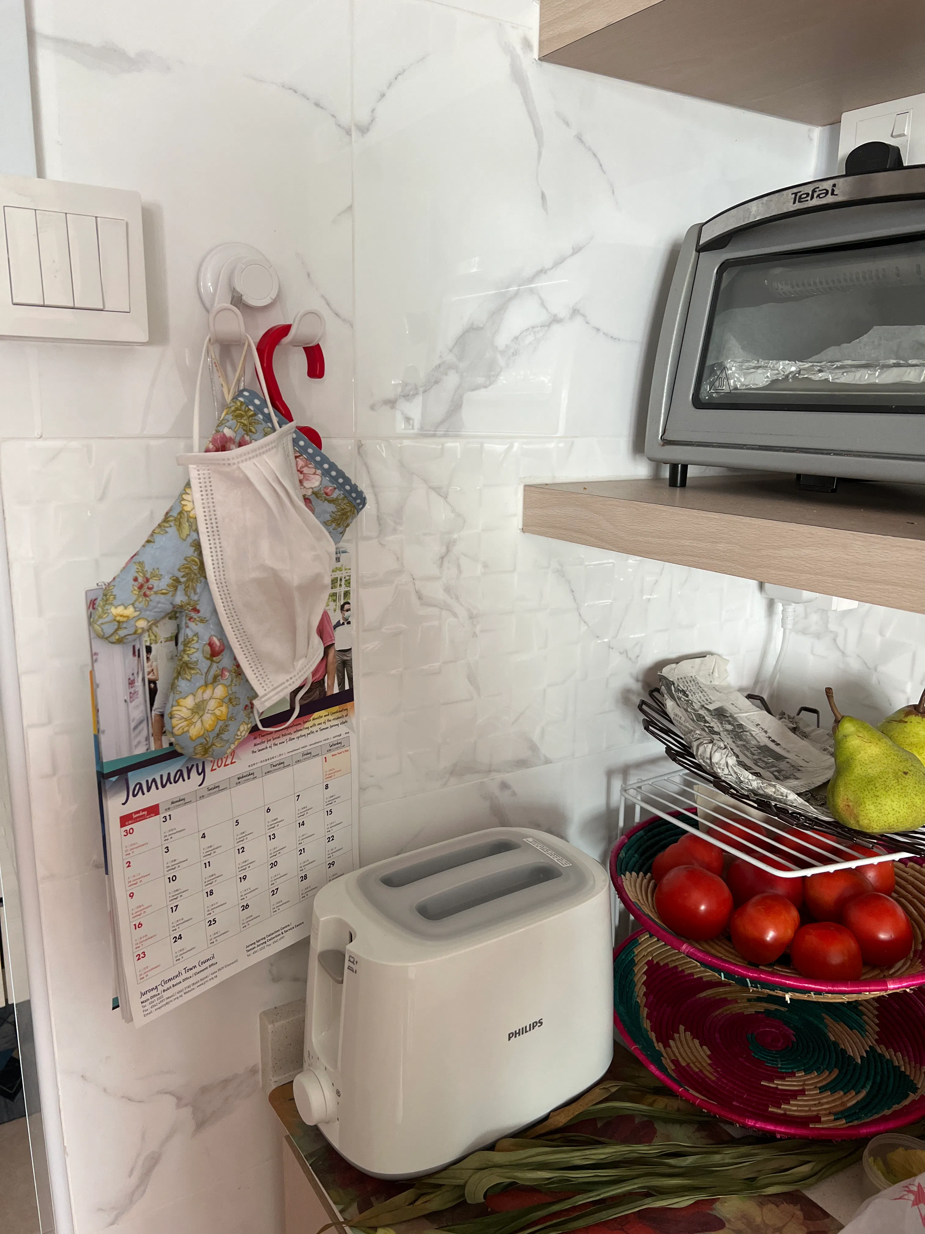 Customer home photo 5: I like this Gel-lock dble hook cos it matches well with my kitchen tiles n also very practical for me to hang  my mask  once I m back from the market plus gloves for the toaster etc. Thanks Hipvan!