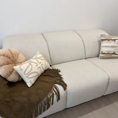 Customer home photo 3: Love everything about this sofa - the colour, fabric and just how it fits so seamlessly into our home. Also styled it a little with cushions and a throw! Absolutely love this, highly recommend!!!