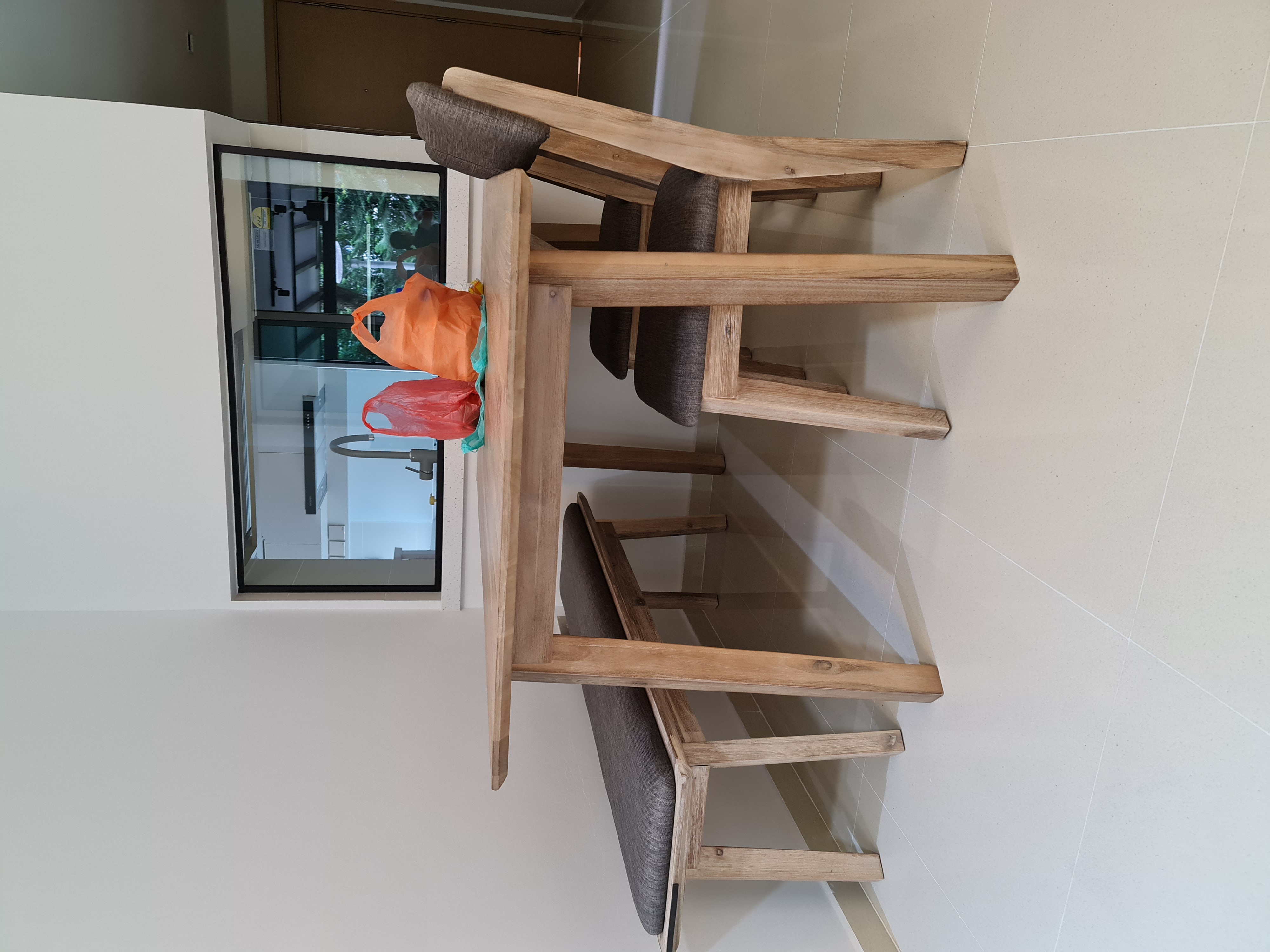 Customer home photo 1: Glad that the chairs are light despite this being solid wood and upholstered.